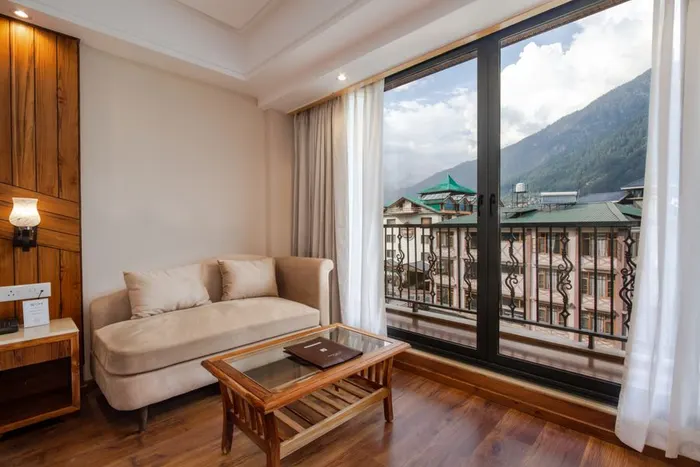 Cosy hotel interior with a mountain view, West Bengal